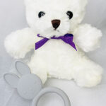 Restful Pump Gift Basket White teddy with purple bow tie with gray teether